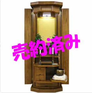 Wooden Buddhist altar (butsudan) with open doors and a small inner shrine; bright pink 'Sold' stamp crosses the image.