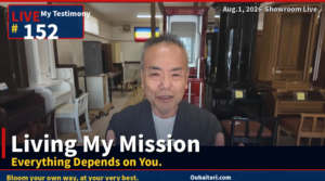 Smiling man speaks on a live showroom livestream, with furniture such as cabinets and chairs visible in the background; overlay text shows 'Living My Mission' and 'Everything Depends on You.'